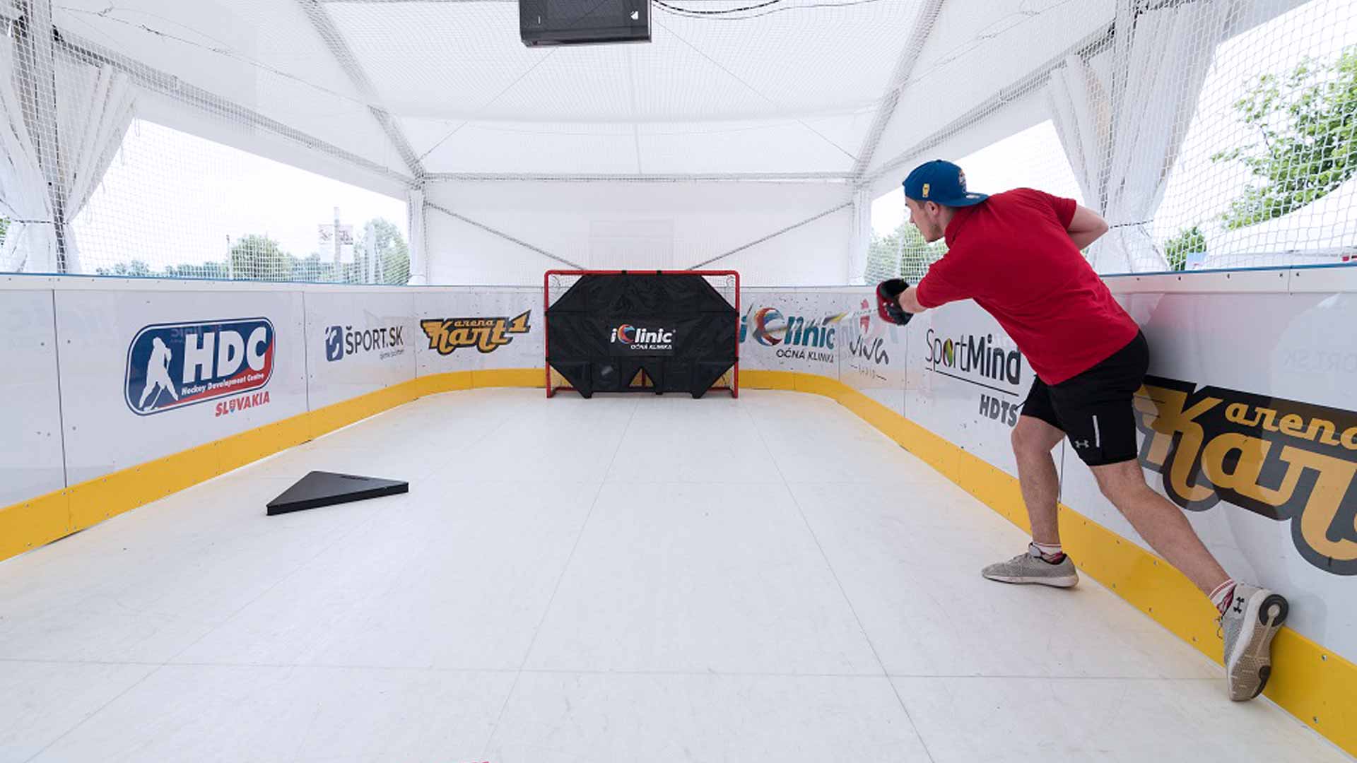 Separate shooting zone with hockey training equipment