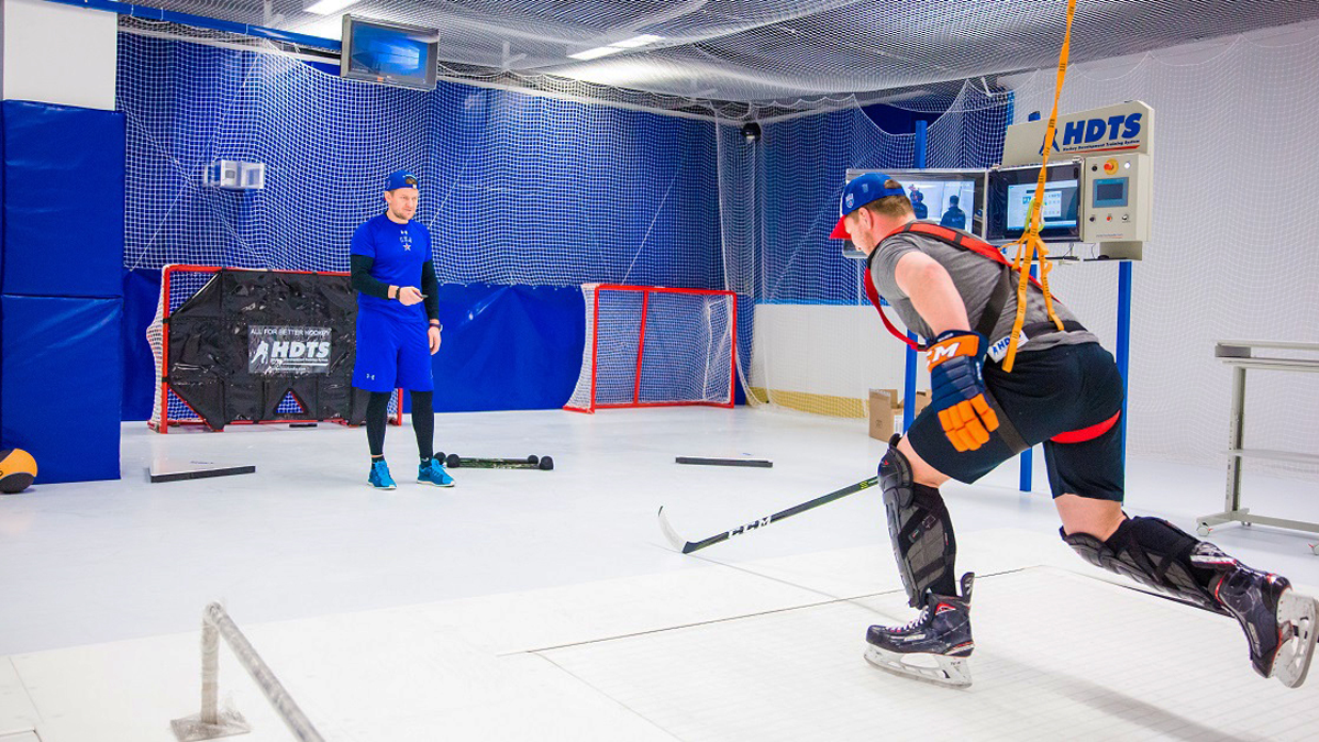 Hockey training center with skatemill equipment